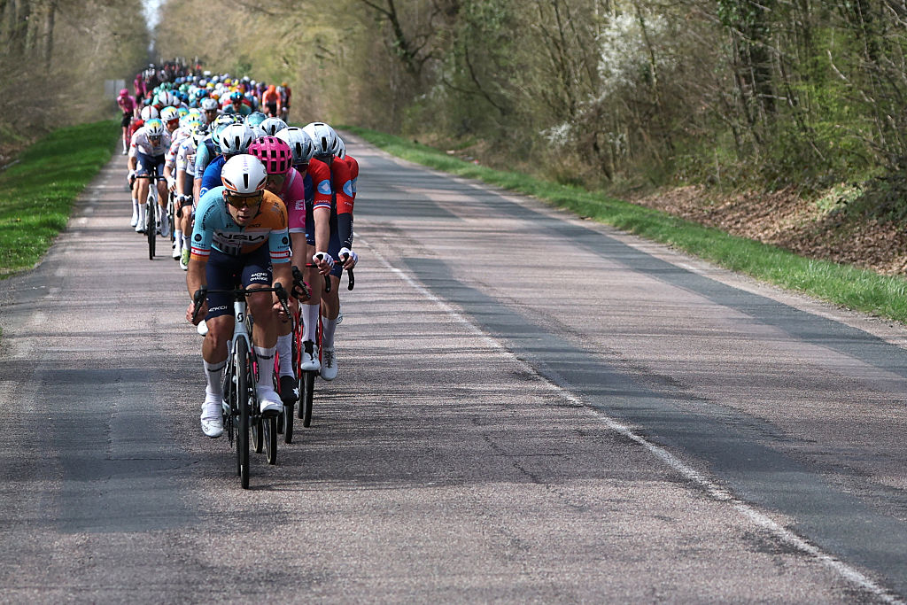 The pack rides during the 2nd stage of the Paris-Nice cycling race, 187 km between &amp;Eacute;p&amp;ocirc;ne and Montargis, on March 9, 2026. (Photo by Anne-Christine POUJOULAT / AFP)