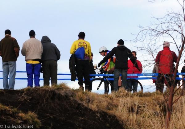 Adam Craig (Giant-Rabobank) rides through a crowd atop a ridge.