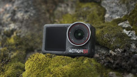 DJI Osmo Action 5 Pro camera on a mossy rock