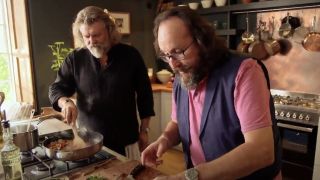 David Myers and Si King cooking in kitchen in Hairy Bikers