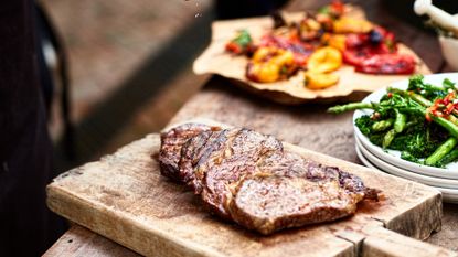 image shows beef steaks with tenderstem broccoloi