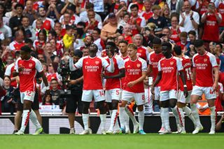 Eddie Nketiah of Arsenal celebrates with teammates after scoring the team's first goal during the Premier League match between Arsenal FC and Nottingham Forest at Emirates Stadium on August 12, 2023 in London, England.