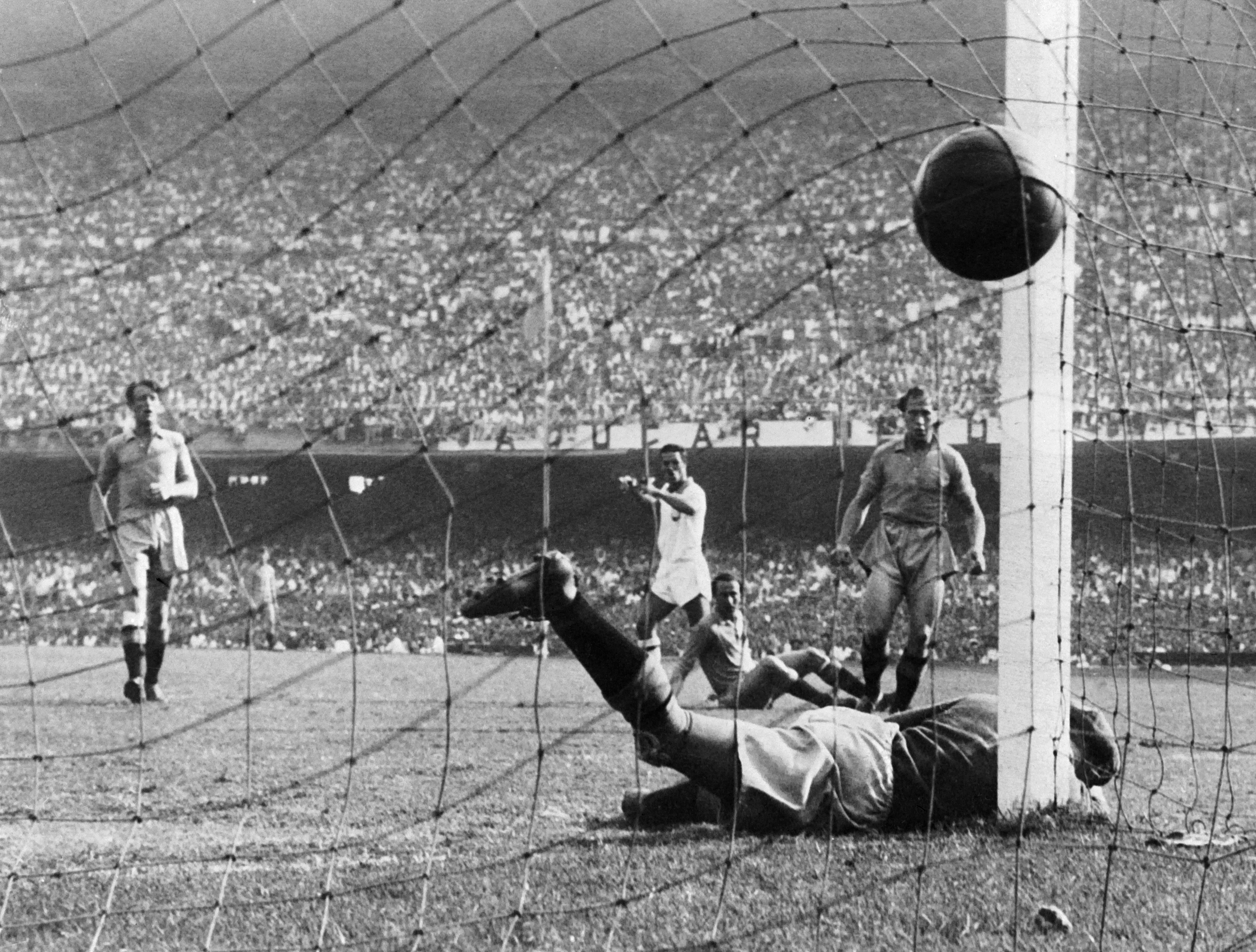 Ademir (centre) scores for Brazil against Sweden at the 1950 World Cup.