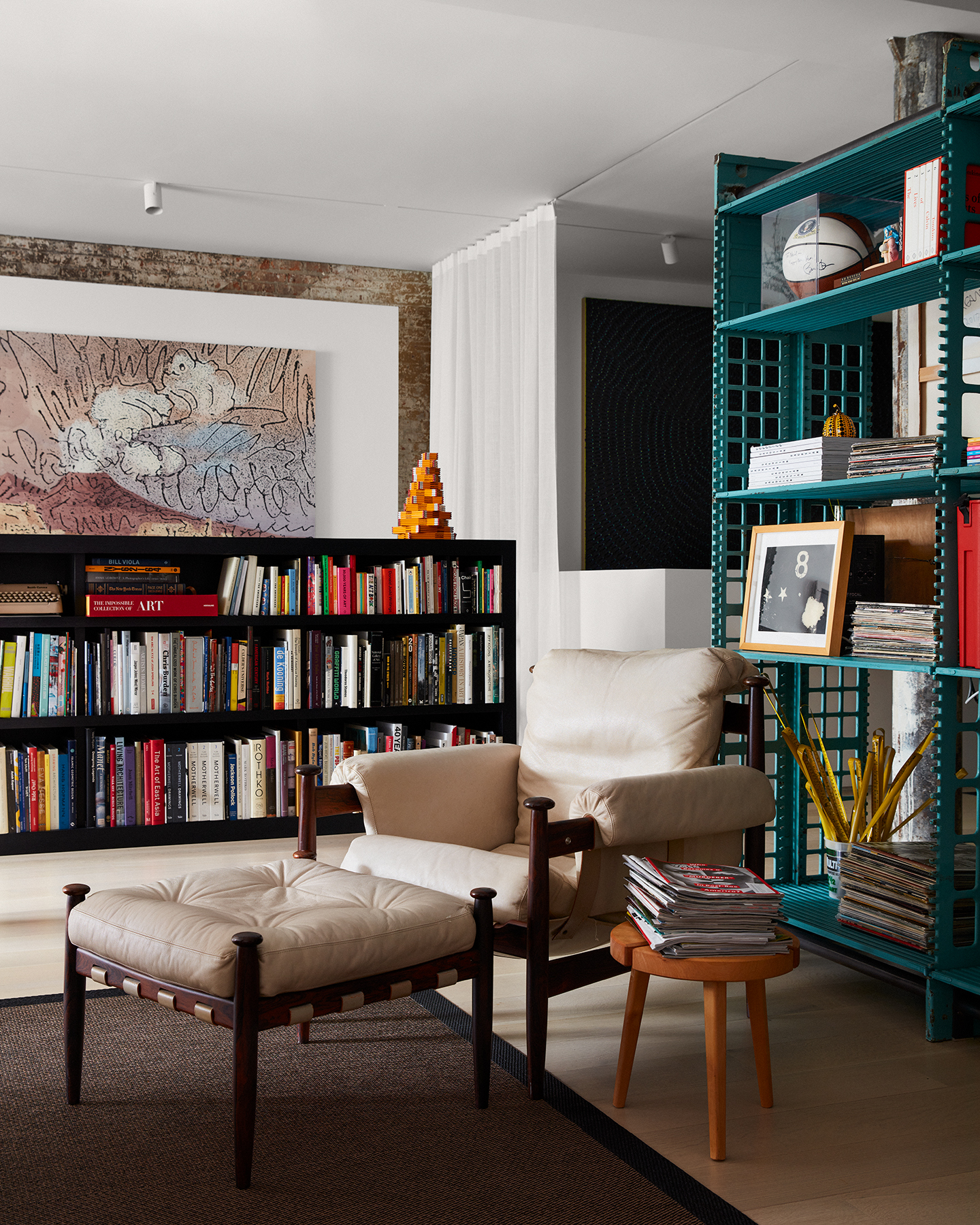 bookshelves, furniture and objects in Manhattan apartment interior