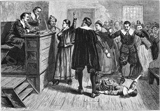 An engraving depicting a scene from the Salem Witch Trials. The central figure in this 1876 illustration of the courtroom is usually identified as Mary Walcott, 17, one of several girls in Salem with a psychological disorder known as mass hysteria, and wh