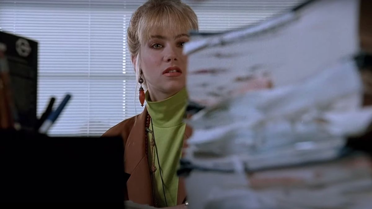 Christina Applegate looks intimidated by paperwork in Don&#039;t Tell Mom The Babysitter&#039;s Dead.