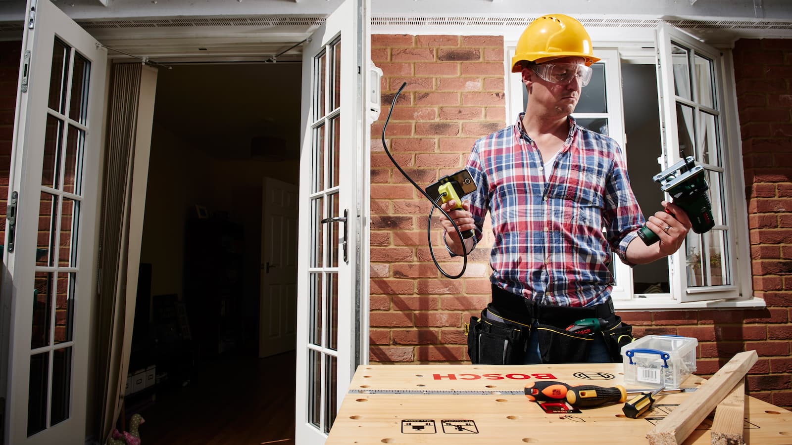 Picture of a man testing a range of home DIY gadgets