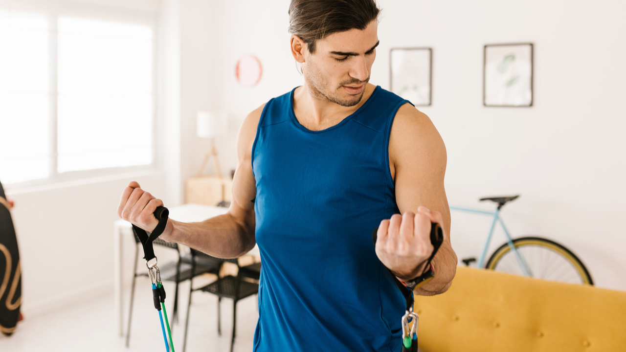 Man doing resistance band bicep curls