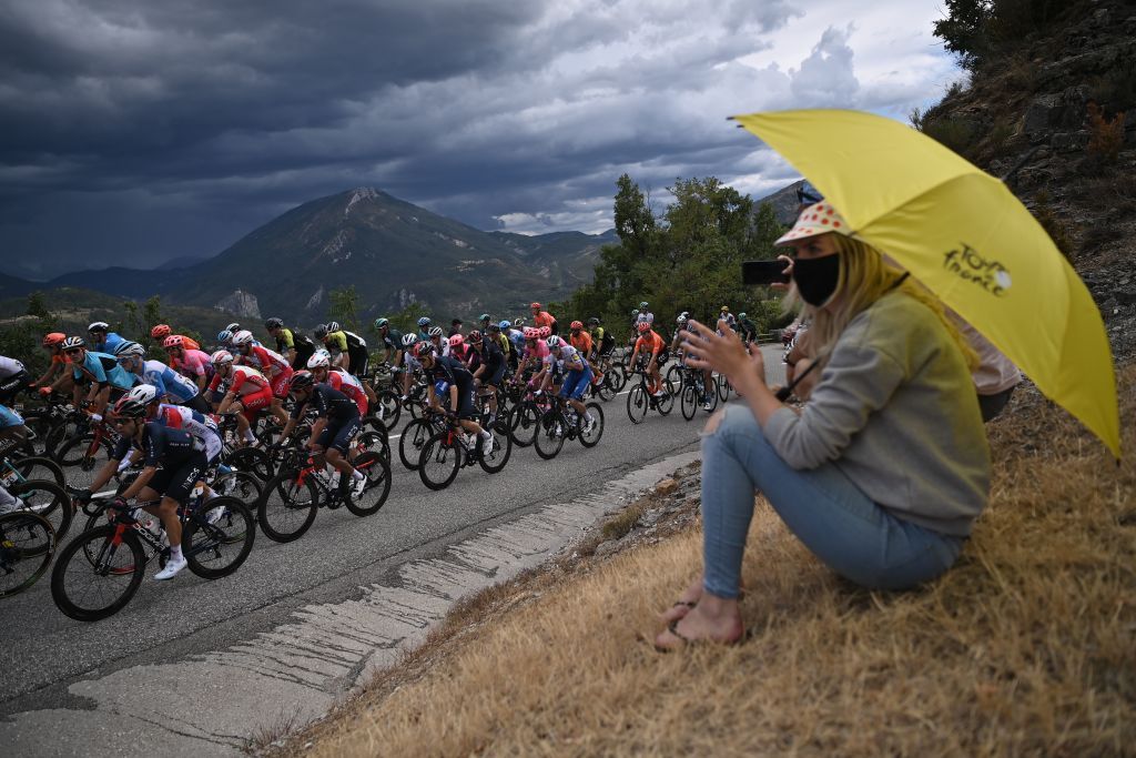 TOPSHOT Spectators watch the riders during the 3rd stage of the 107th edition of the Tour de France cycling race 198 km between Nice and Sisteron on August 31 2020 Photo by Marco BERTORELLO AFP Photo by MARCO BERTORELLOAFP via Getty Images