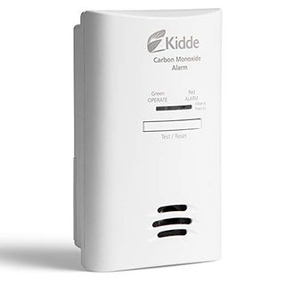 A rectangular white plastic carbon monoxide detector