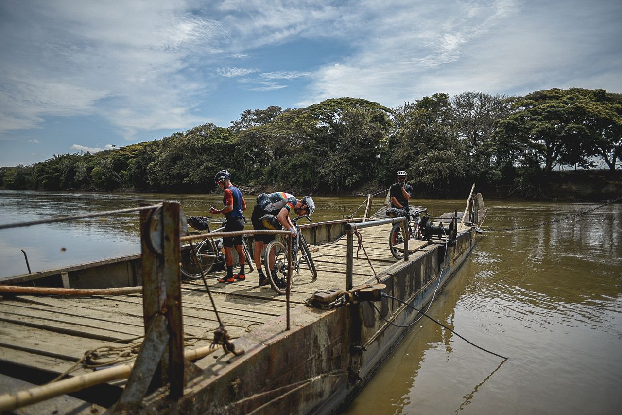 Ten dam with other lead riders crossing the Cauca River on a local ferry