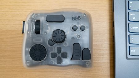 Tourbox Elite Plus next to a laptop
