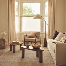 White living room with nesting coffee tables