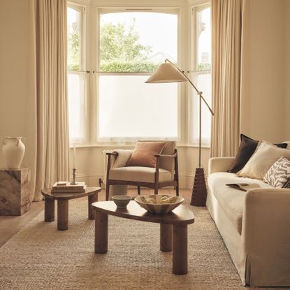 White living room with nesting coffee tables