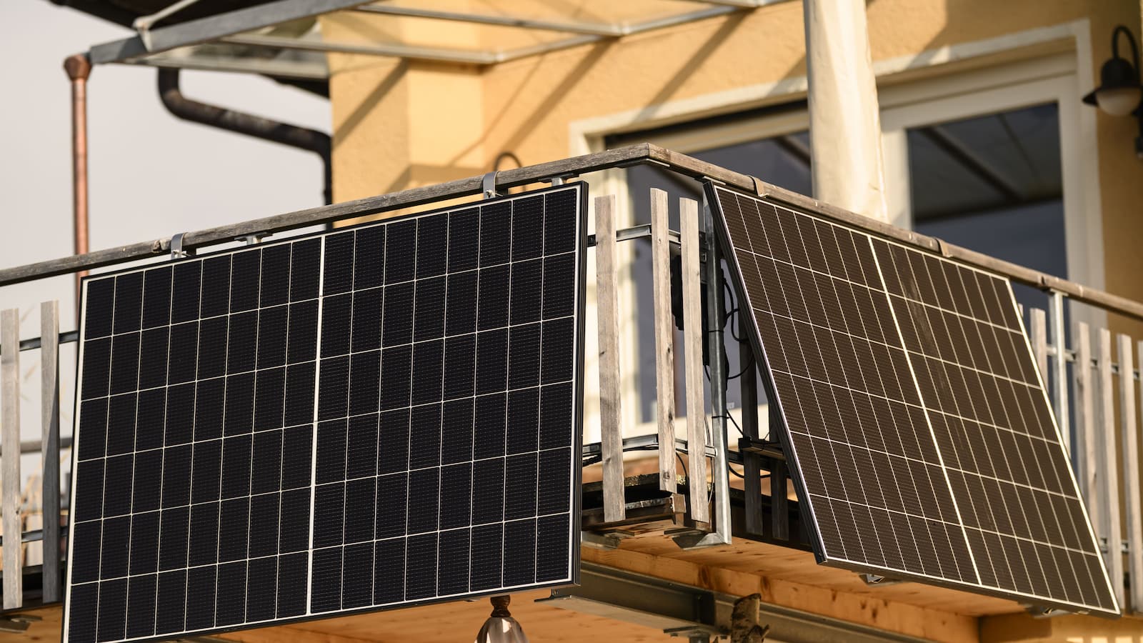 Plug-in solar panels on a balcony on a house