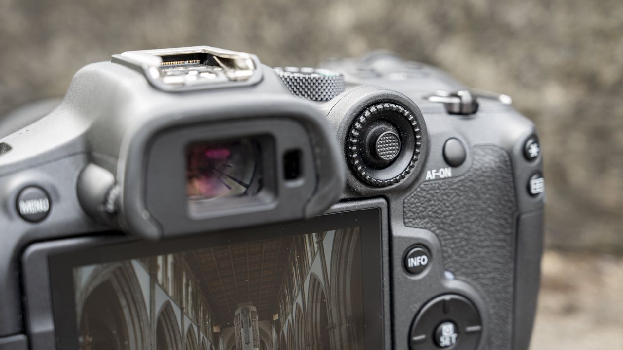 The Canon EOS R7 camera sitting on a stone step