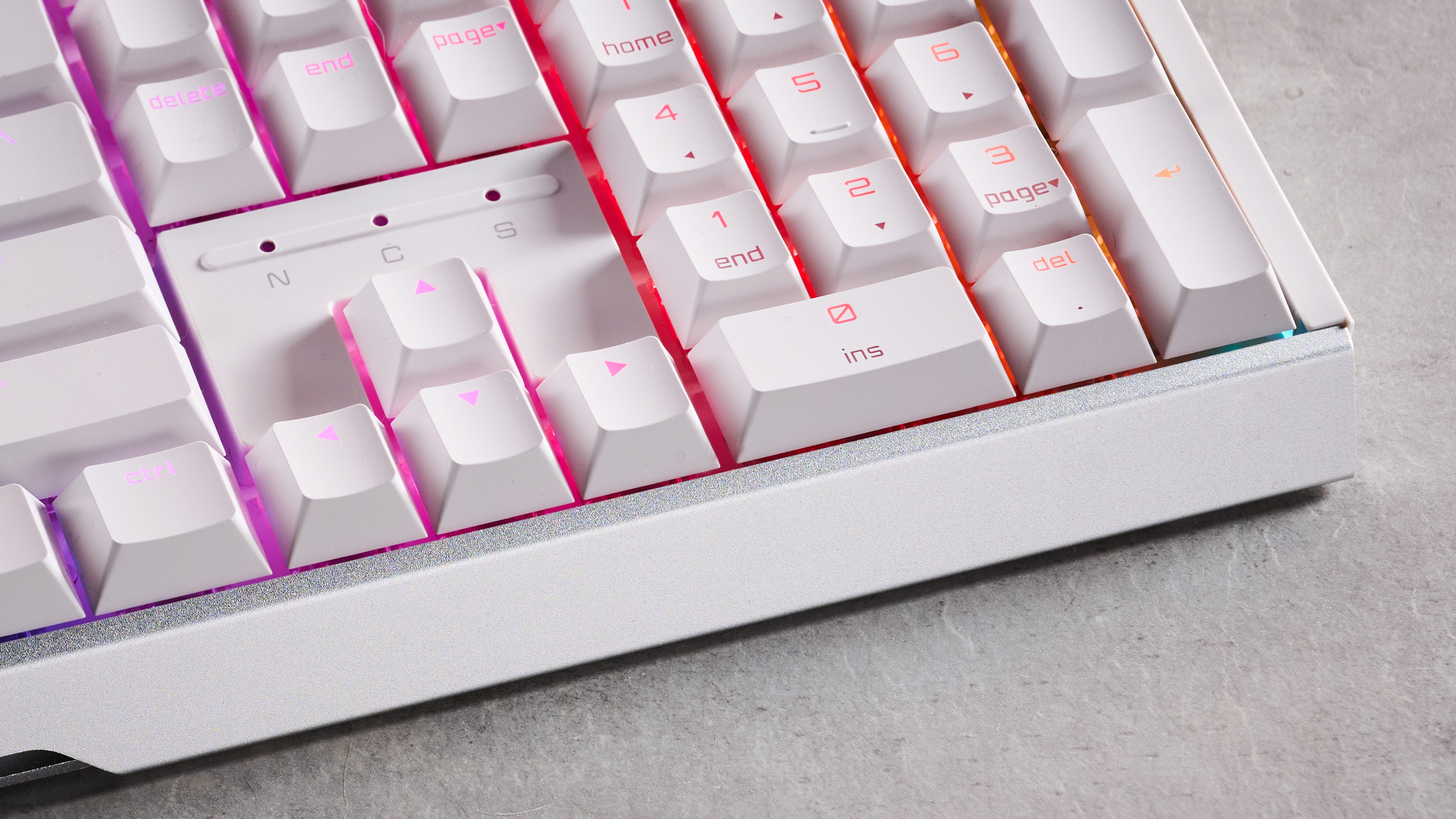Close-up of arrow keys and number pad on Cherry XTRFY MX 3.1 with RGB lighting on