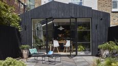Exterior of a modern kitchen extension with charred timber cladding