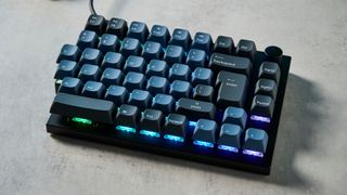 A carbon black Keychron Q11 split ergonomic keyboard