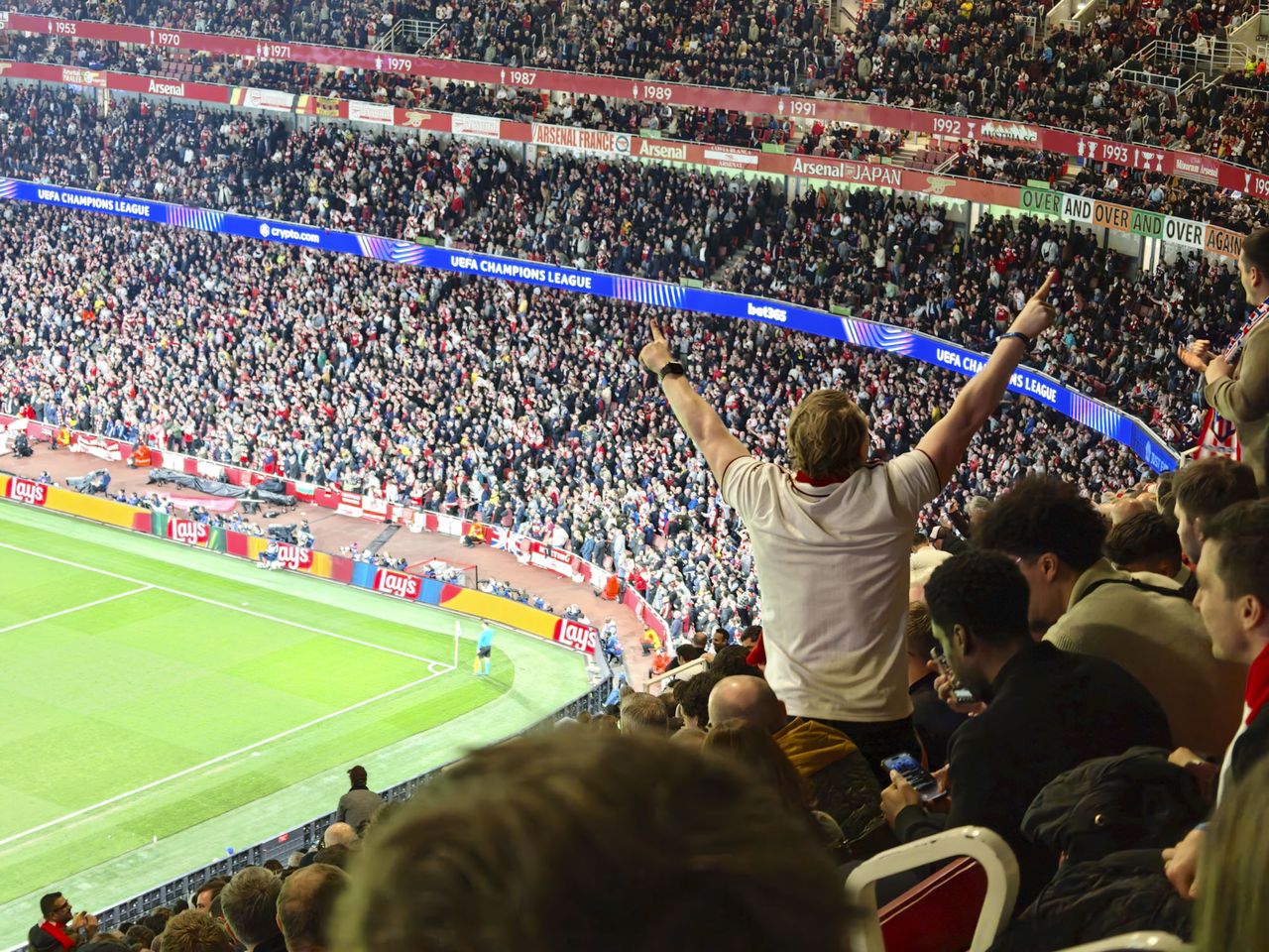 Action photos during a Champions League soccer match at Arsenal's Emirates stadium, taken with the Oppo Find X9 Ultra and teleconverter lens