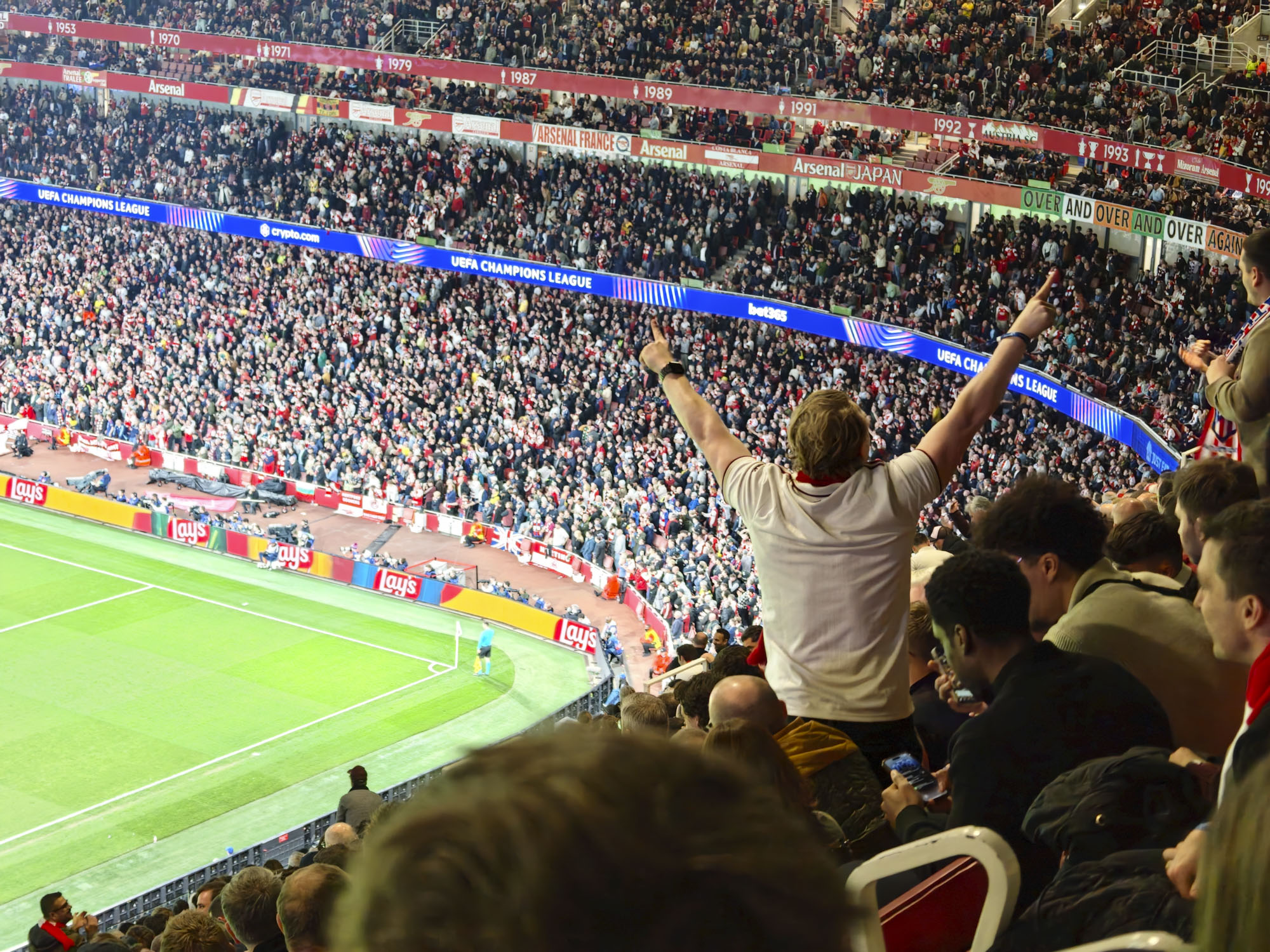 Action photos during a Champions League soccer match at Arsenal's Emirates stadium, taken with the Oppo Find X9 Ultra and teleconverter lens