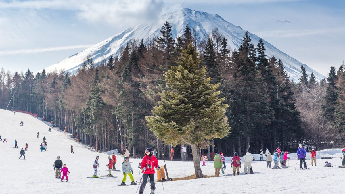 Mount Fuji view with Crowd tourists enjoy of ski resort Fujiyama Top beautiful in Japan beautiful landscape in winter time at Fujiten ski resort