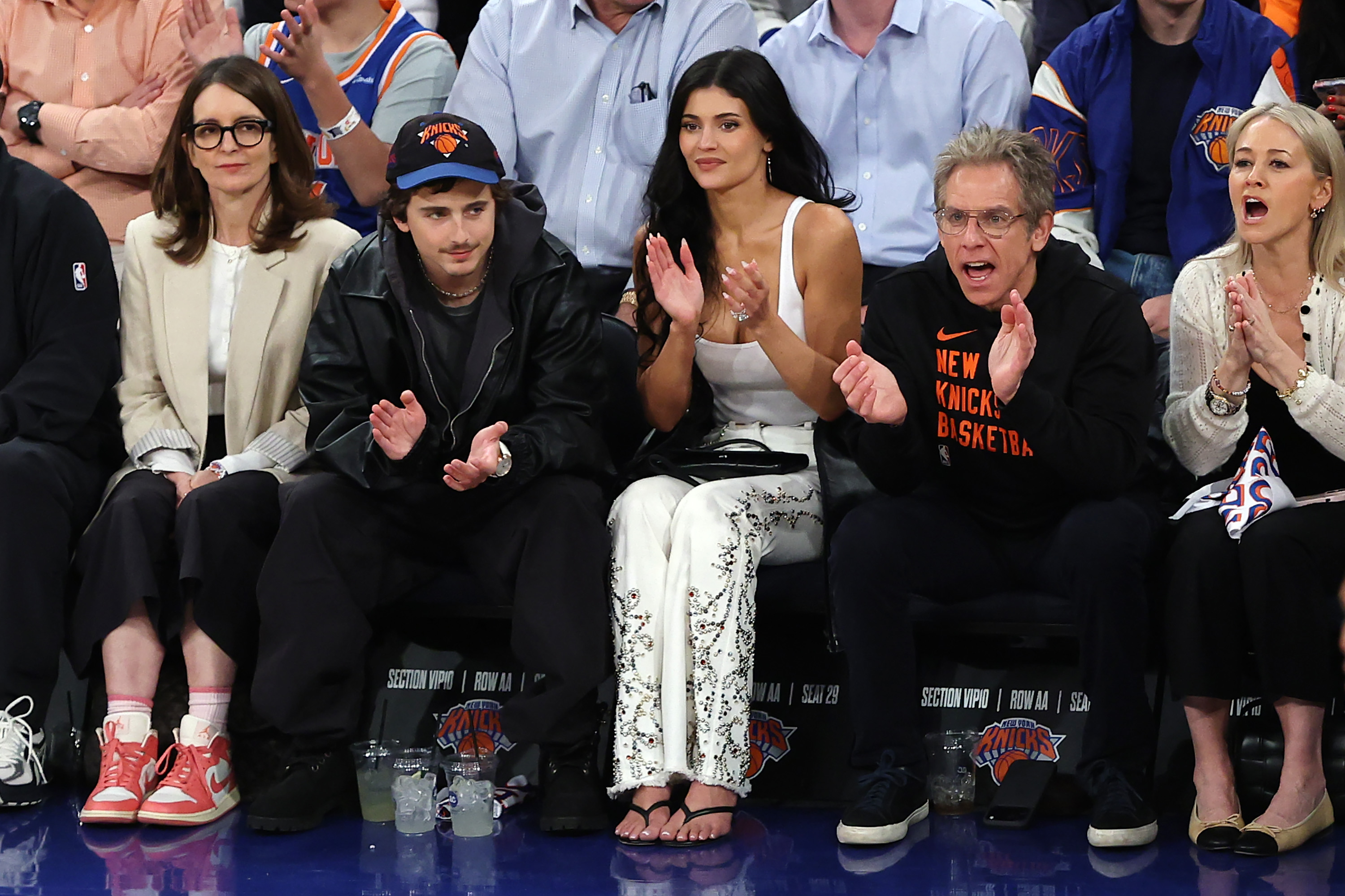 Kylie Jenner joined Timoth&amp;eacute;e Chalamet at another Knicks basketball game in white bedazzled jeans and the heeled flip-flops trend