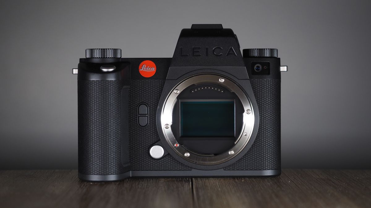 Leica SL3-S on a wooden surface with moody lighting