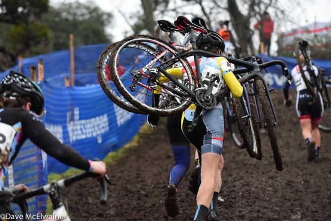 The Elite Women running uphill in thick mud