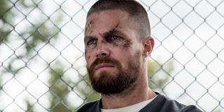 arrow season 7 stephen amell oliver queen beaten up prison the cw