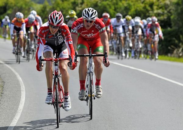 Two more riders attempt to get away from the peloton.