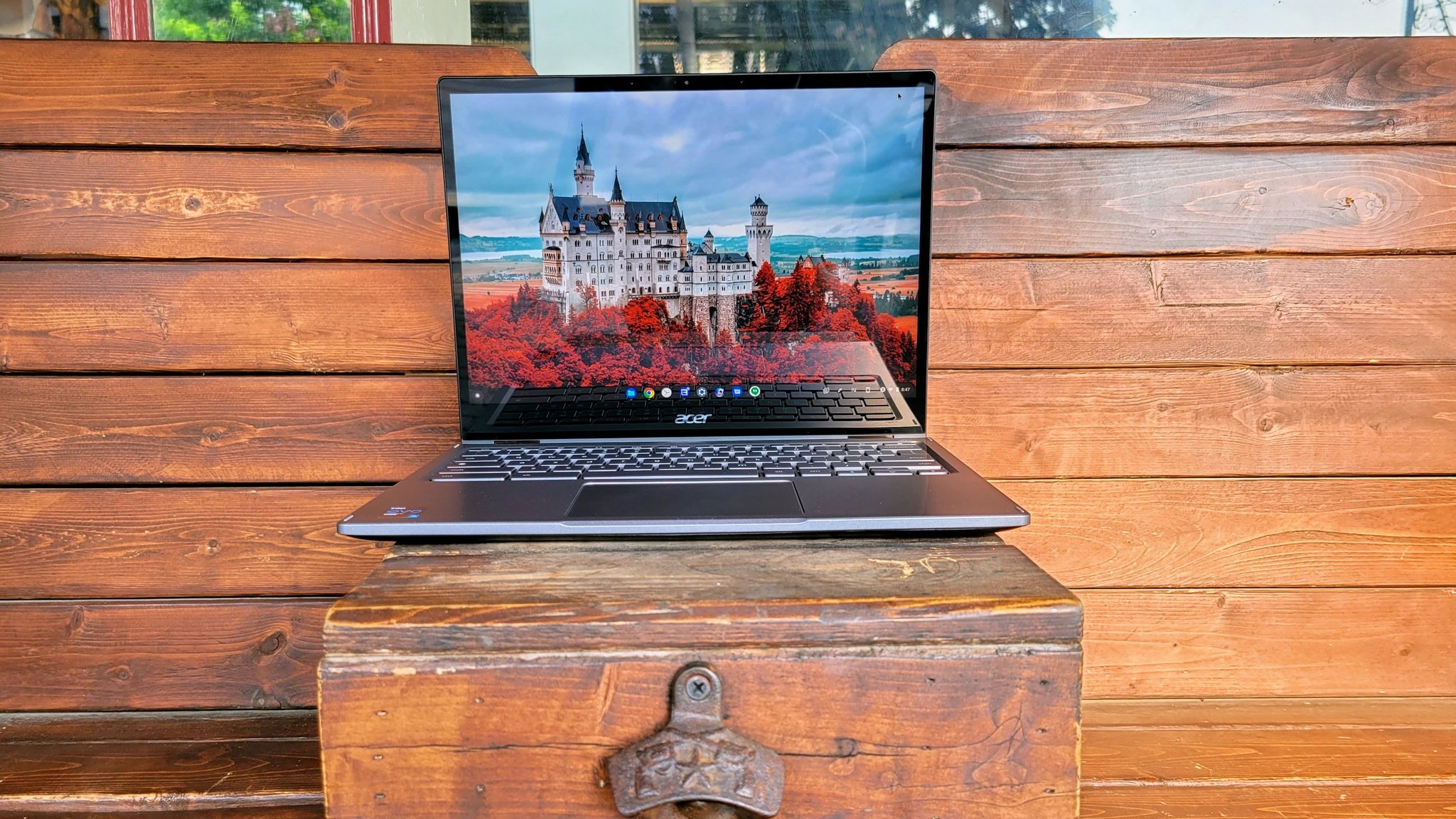 Acer Chromebook Spin (2021) sitting on a bench with the screen open
