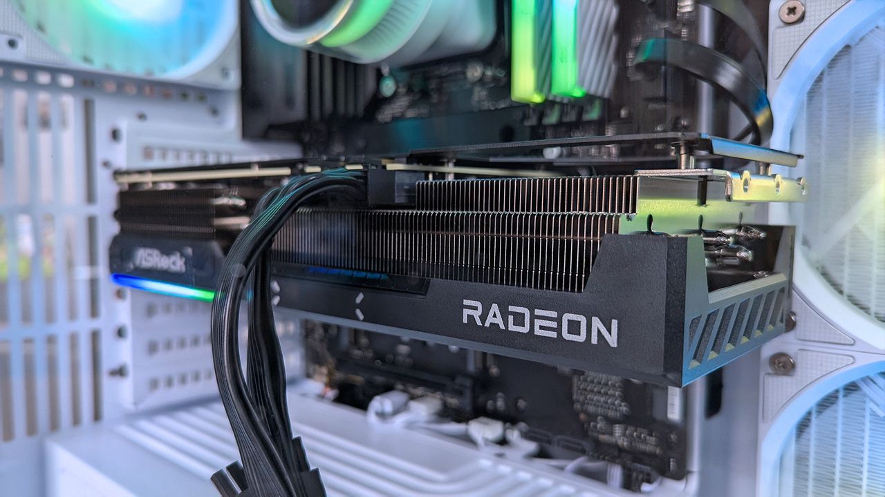 A close-up of a Radeon graphics card inside an iBUYPOWER RDY Trace X R01 pre-built gaming PC with RGB lighting. The card is prominently installed, showing cooling fins and power cables.
