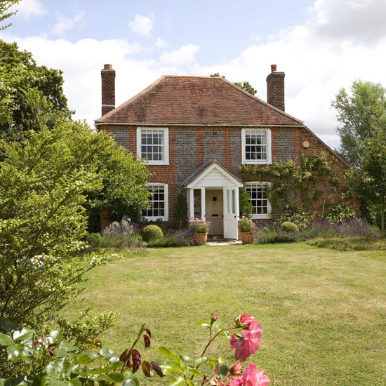 villa exterior with brick wall