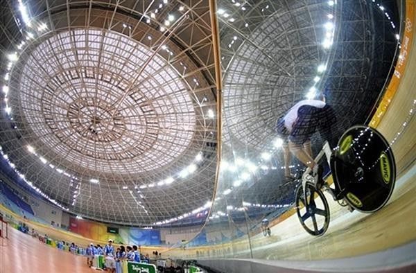 An American track rider circles around the boards