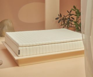 An Earthfoam mattress on a low platform bed