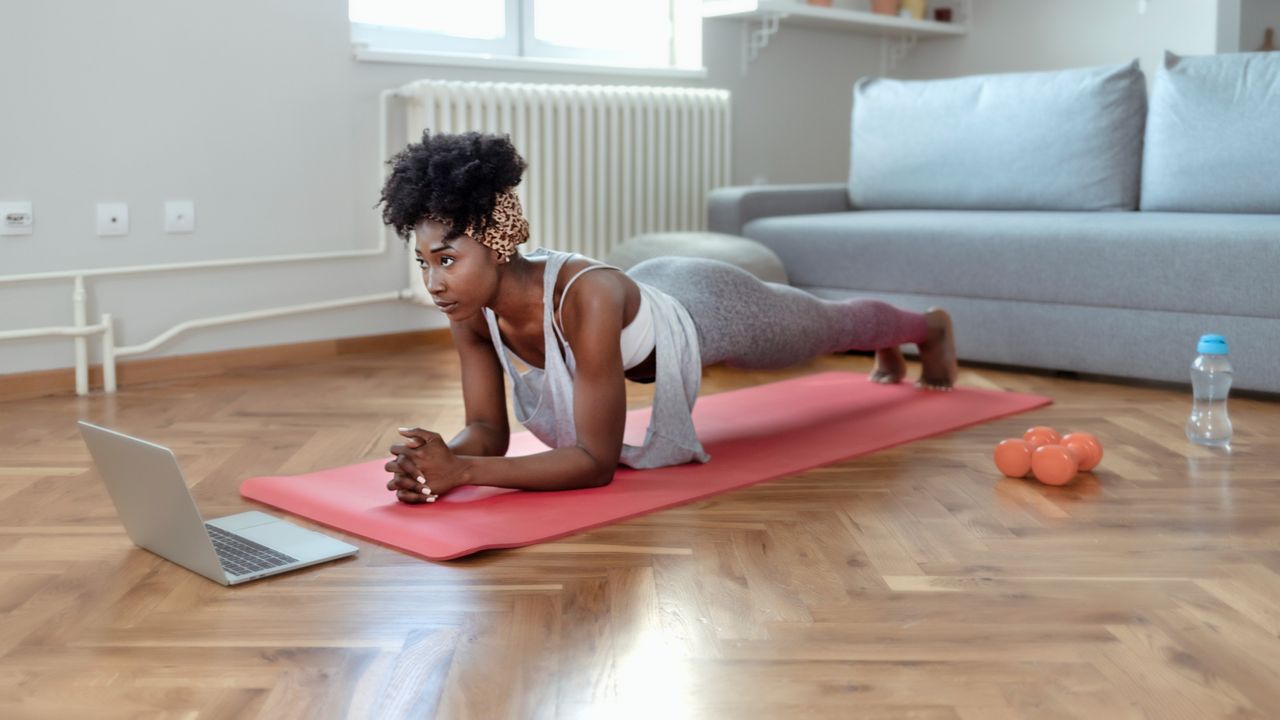 Woman holding a plank position at home