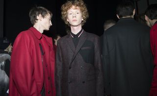 Male models wearing black and red jackets from the Kris Van Assche AW2015 collection