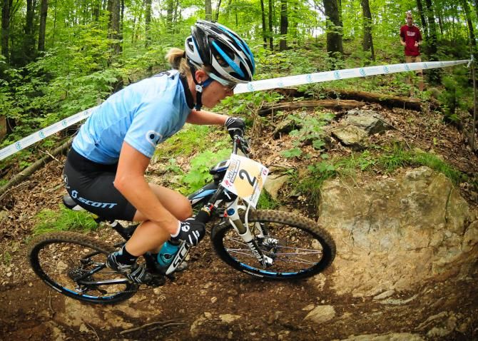 Chloe Woodruff (Crank Brothers) riding in second place on lap three