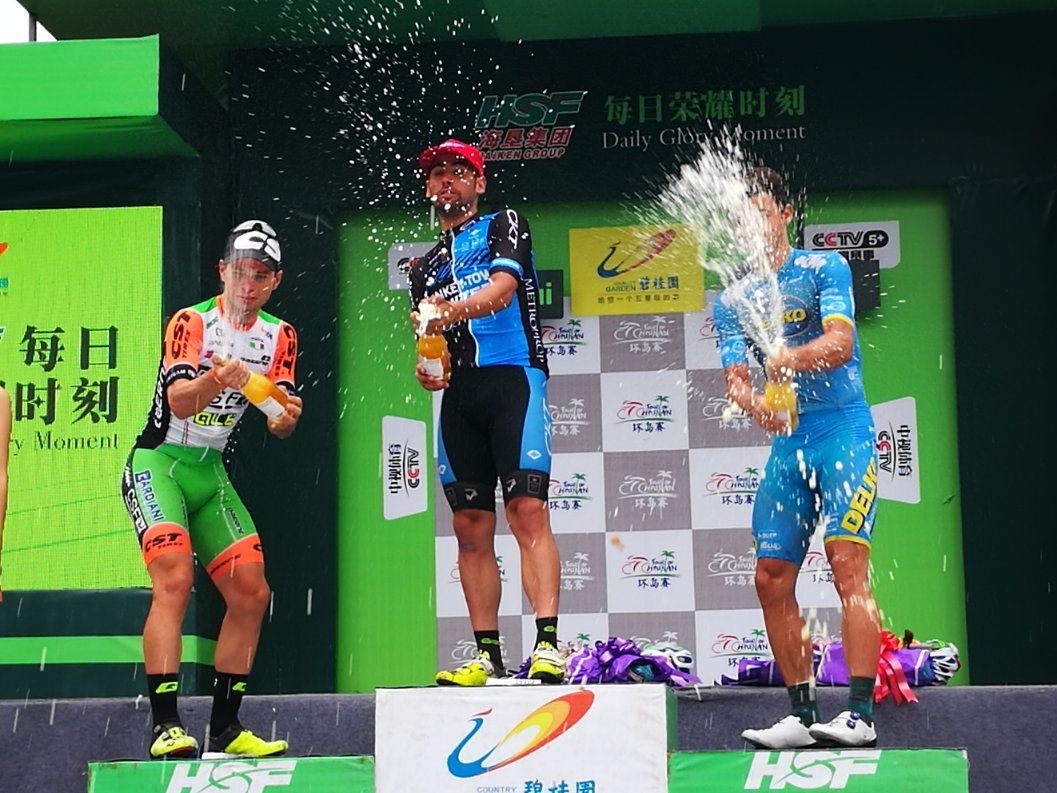 Marco Zanotti (Monkey Town) celebrates on the podium with Marco Maronese and Emils Liepins.