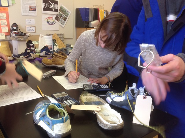 Kids analyze shoes with instruments