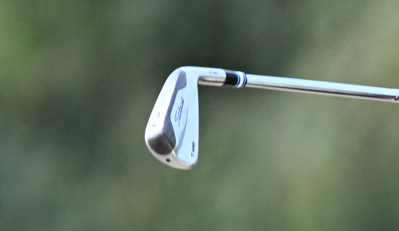 A close up of Patrick Reed's 2 iron