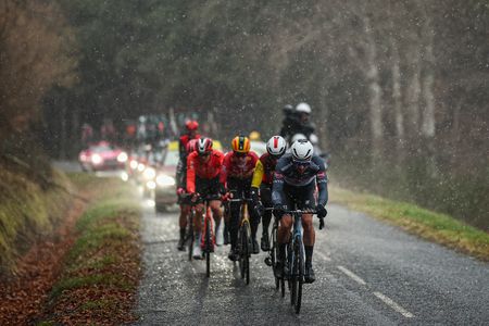 Alpecin-Deceuninck's Belgian rider Edward Planckaert (R) cycles leading a breakaway under the rain during the 4th stage of the Paris-Nice cycling race, 163,4 km between Vichy and La Loge des Gardes, on March 12, 2025. (Photo by Anne-Christine POUJOULAT / AFP)