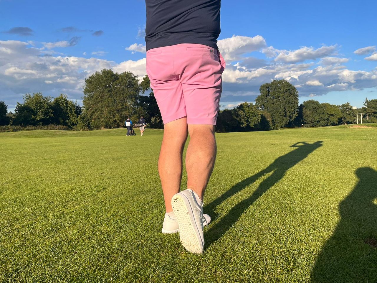 A close up shot of Mike Harris testing the adidas samba golf shoe on course