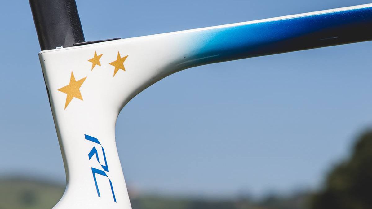 A deep metallic blue fades to white on the frameset with the stars of Europe adorning the seat cluster
