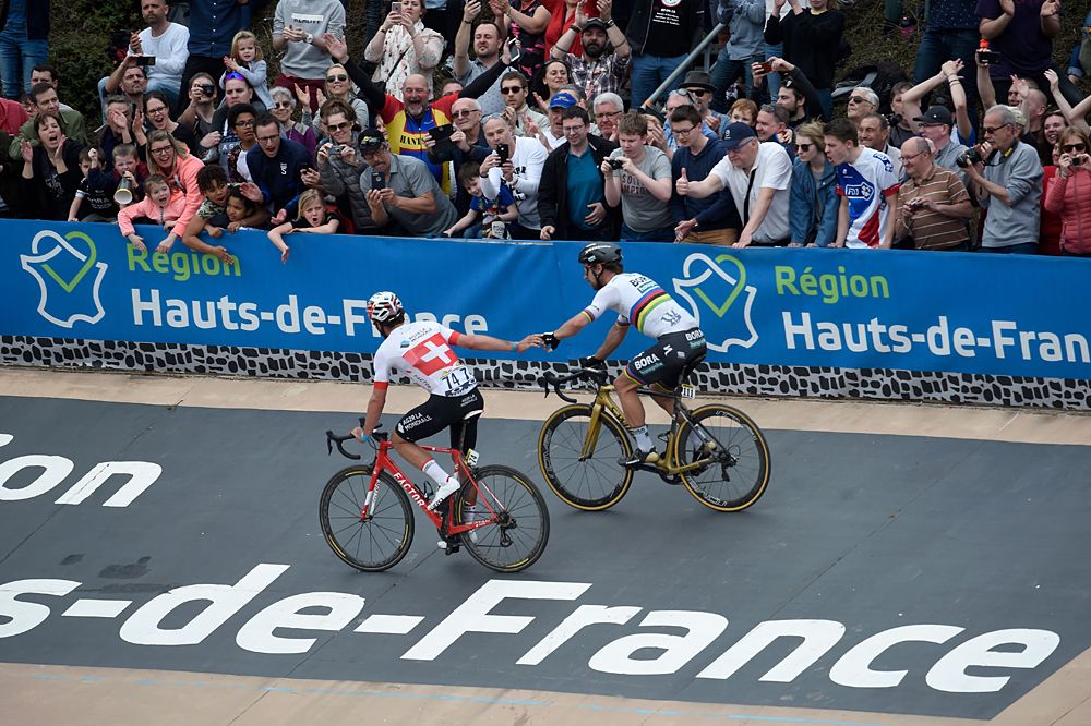 Peter Sagan and Silvan Dillier shake hands after the two-up sprint in the Roubaix Velodrome