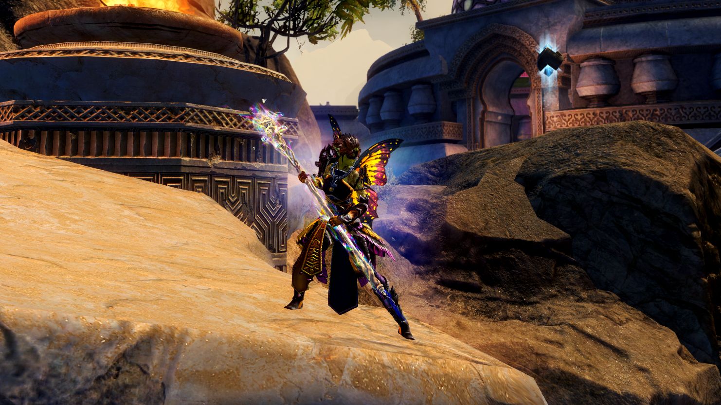 A Guild Wars 2 character holding the rainbow staff Bifrost