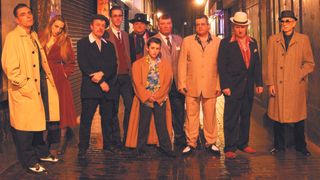 The Ponces stand in an alleyway in London's Soho at night.