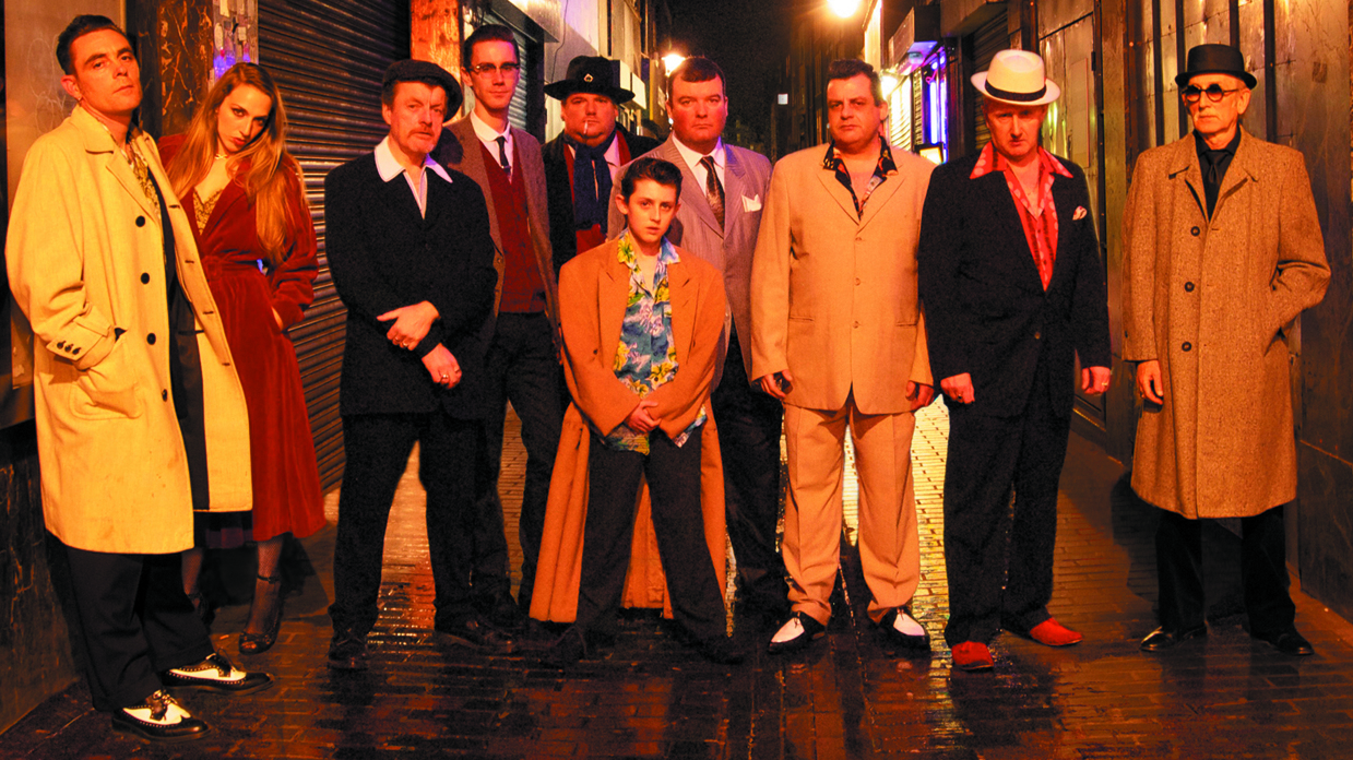 The Ponces stand in an alleyway in London&#039;s Soho at night.