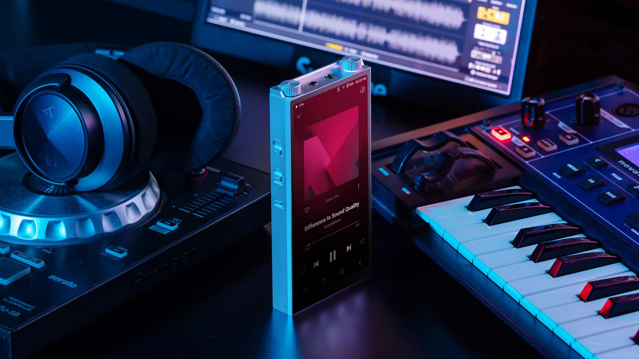 The A&amp;K PD20 next to a keyboard and headphones.